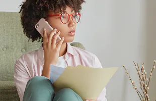 Therapist on phone managing compliance across states
